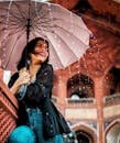 Low-angle View of Woman Holding Umbrella Under the Rain